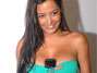 Larissa Riquelme fez gra�a para os fot�grafos e colocou o celular nos seios, atitude esta que a tornou famosa, na Copa do Mundo de 2010. Foto: Mauro Horita/Terra