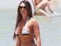Nicole Bahls aproveitou o dia de sol para se bronzear na praia da Barra da Tijuca, no Rio. Foto: Delson Silva/AgNews