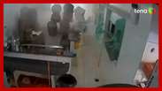 The camera captures the moment a pressure cooker explodes in a pizzeria in MG