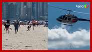 Helicóptero faz ‘chover’ dinheiro em praia de Santa Catarina