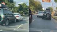 Briga de tr&acirc;nsito termina com carro sendo arrastado por outro em avenida de BH