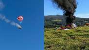 Veja momento em que avi&atilde;o monomotor pega fogo no ar e cai com paraquedas acionado em MG