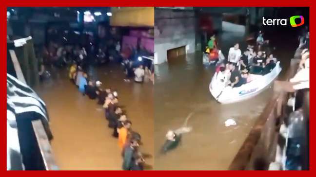 RS: Moradores fazem 'corrente humana' para resgatar pessoas ilhadas em Canoas