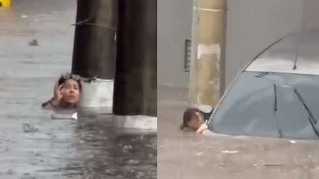 Mulher abandona carro e se agarra em poste para não ser levada pela água durante enchente em Guarulhos